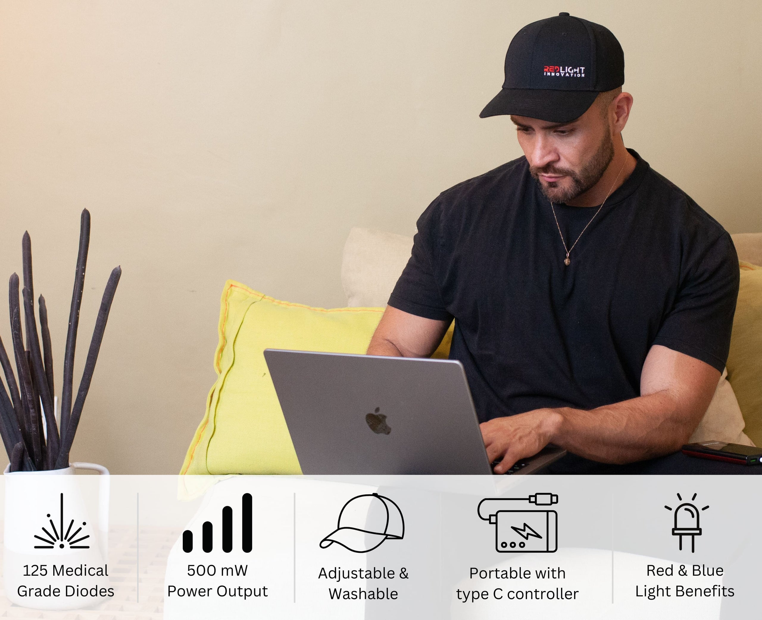 Man using a laptop with product features listed below on a beige background